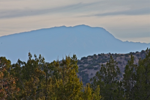 You can see the Sandia Mountains from the foot of the trail.